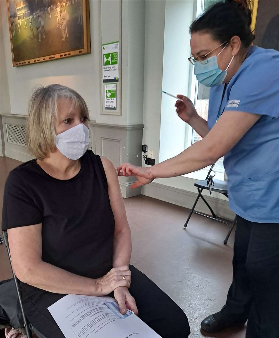Marilyn Read gets her jab, from Jenica Brezeneau. Picture:East Kent Hospitals University NHS Foundation Trust