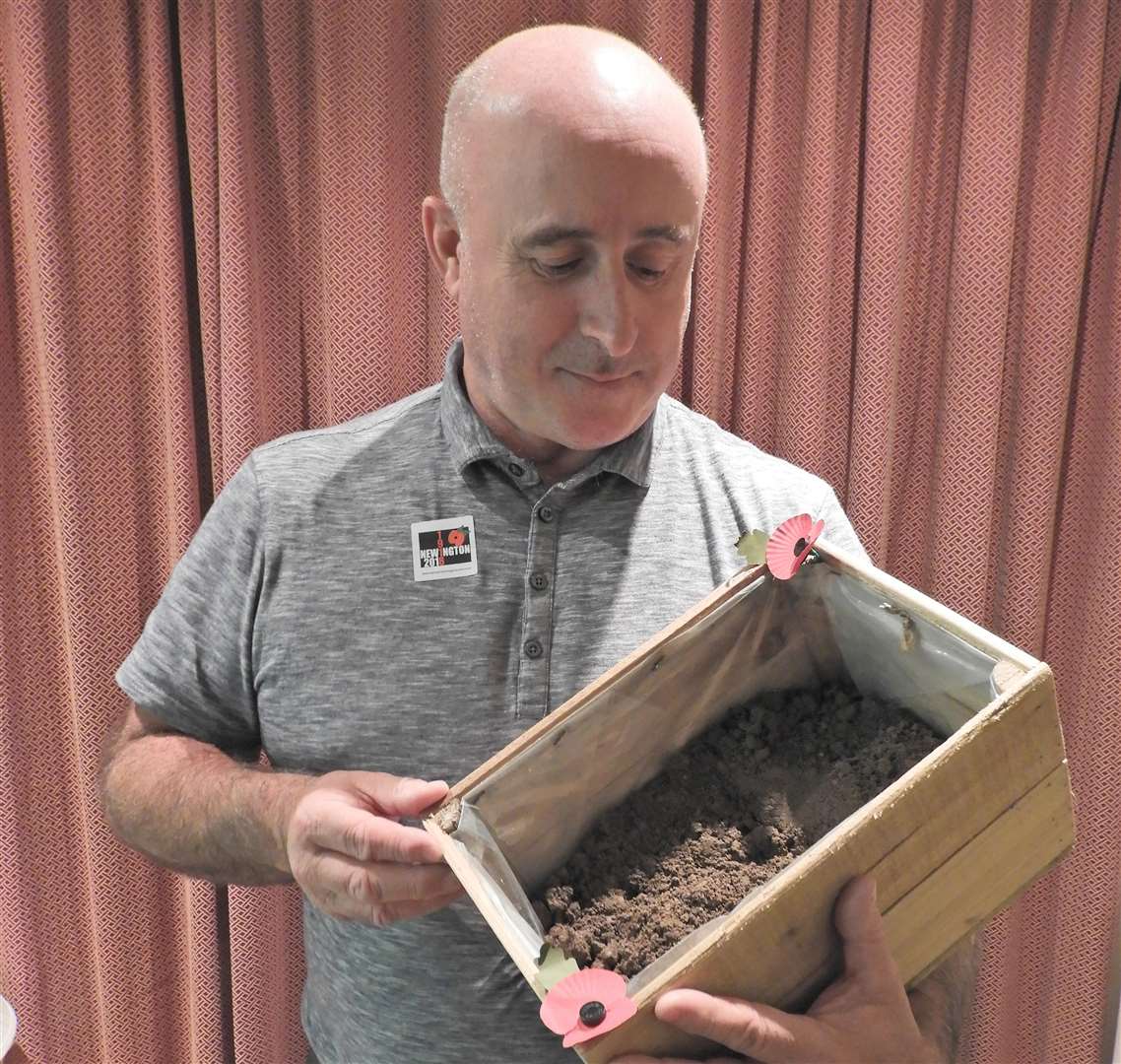 Dean Coles, chairman of Newington History Group, with the gifted soil
