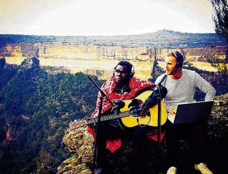 Gary Barlow with Australian aboriginal musician Gurrumul in the Blue Mountains, Australia, taken from Gary Barlow On Her Majesty's Service. Picture: Mark Jones/BBC