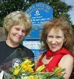 Sanctuary owner Margaret Todd, left, presents Anita Dobson with flowers. Picture: MARTIN APPS