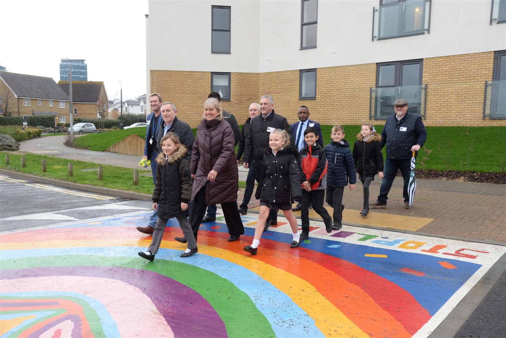 Children, teachers and councillors using the new crossing. Picture: Chris Davey