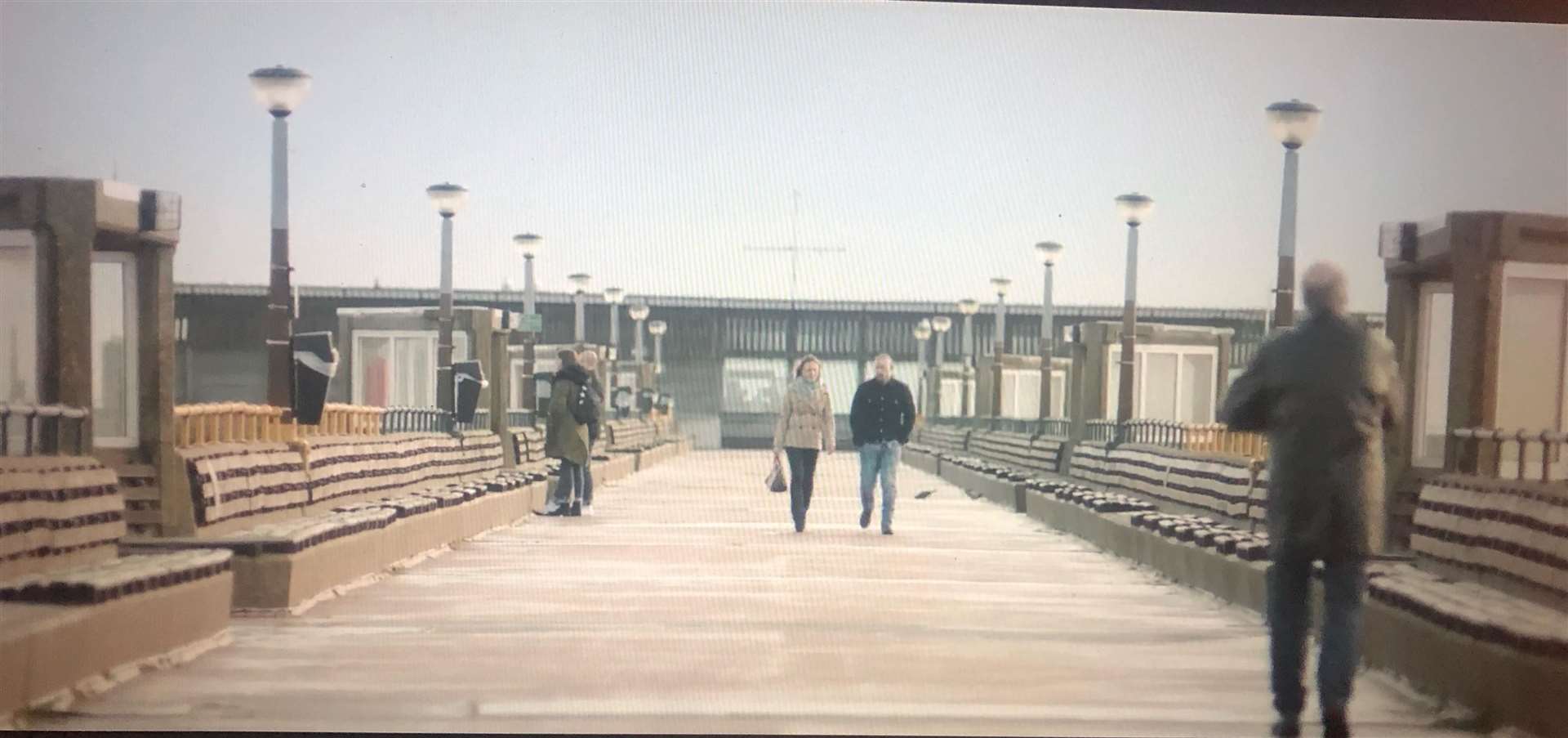 Michael Socha and Zoë Tapper walking along the pier in Deal. All pictures taken from Netflix
