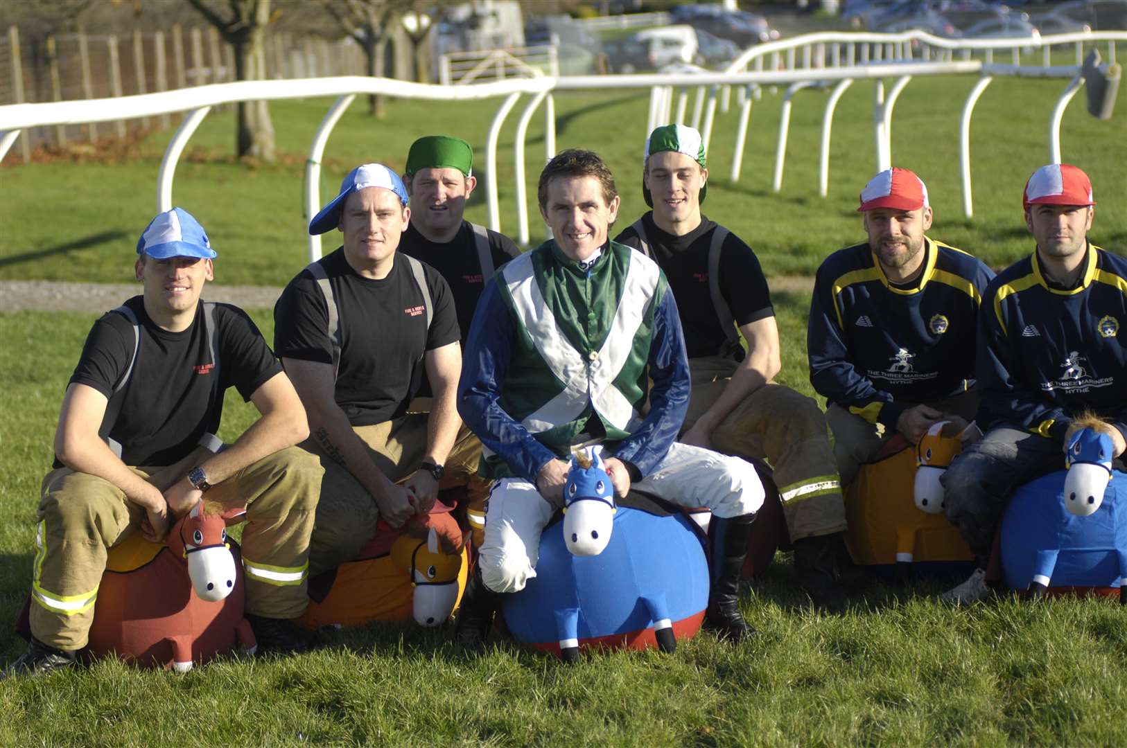 Firefighters from Hythe station and locals from The Three Mariners pub race on spacehoppers with champion jockey Tony McCoy in November 2010