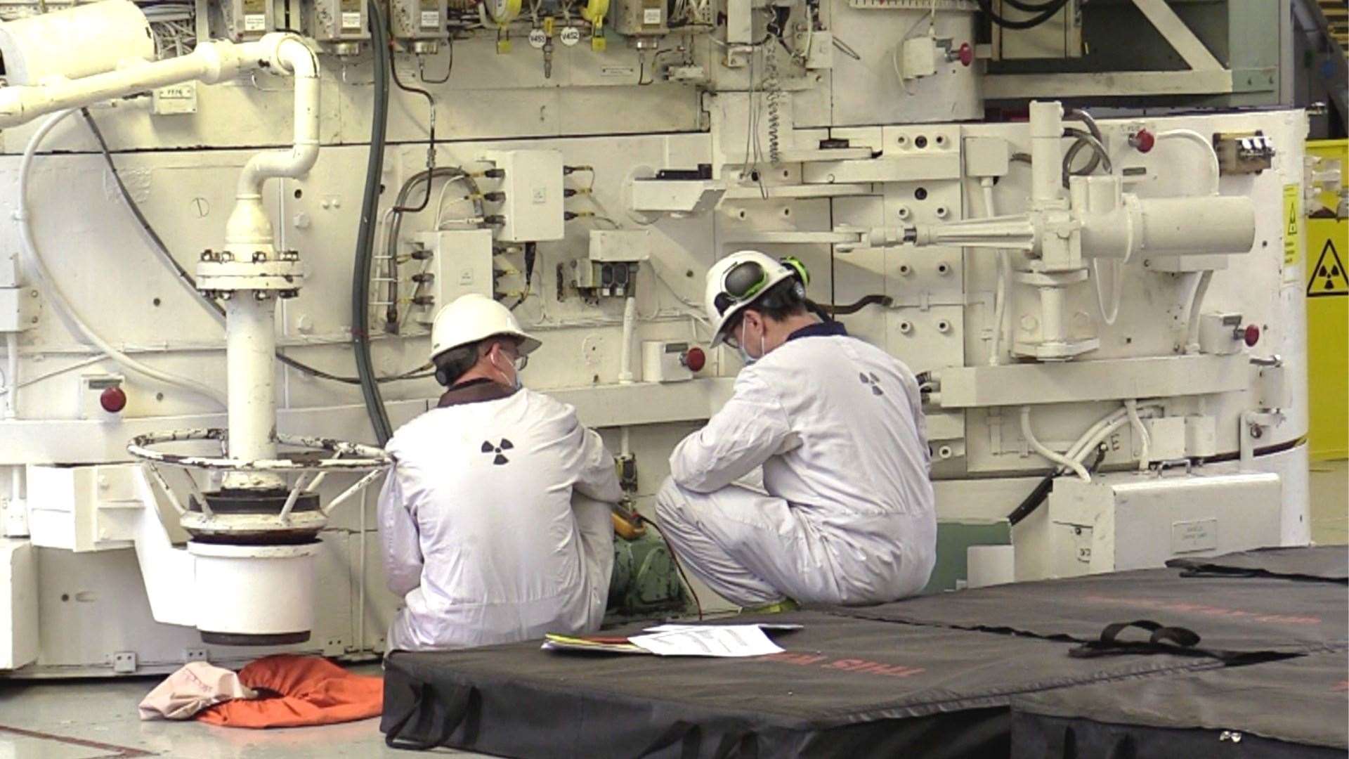 Dungeness employees at work in the reactor room
