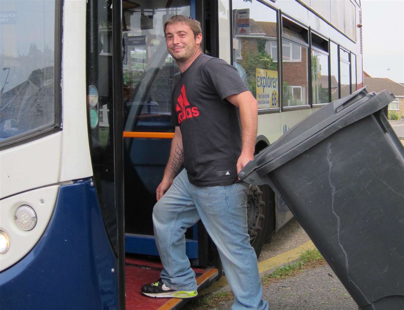 David Bridgman attempts to take his wheelie bin to the tip on the bus. Picture: Jamie Stephens