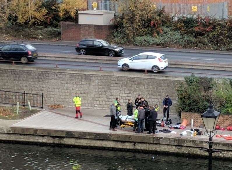 The man was pulled from the river and treated by paramedics