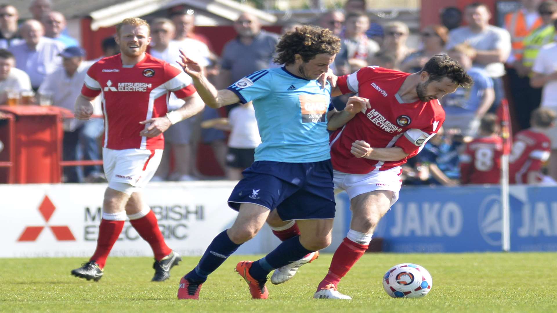 Dean Rance battles with Whitehawk's Sergio in the play-off semi-final Picture: Ruth Cuerden