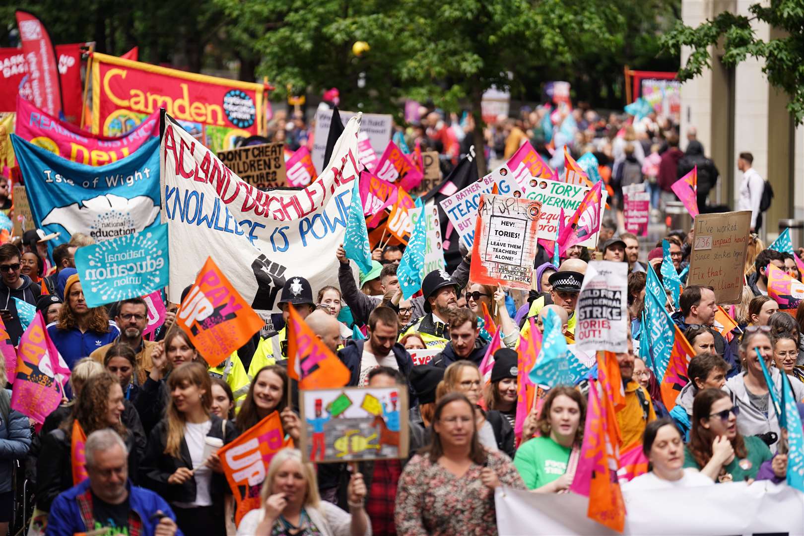 Members of the National Education Union take part in a rally through Westminster to Parliament Square (James Manning/PA)