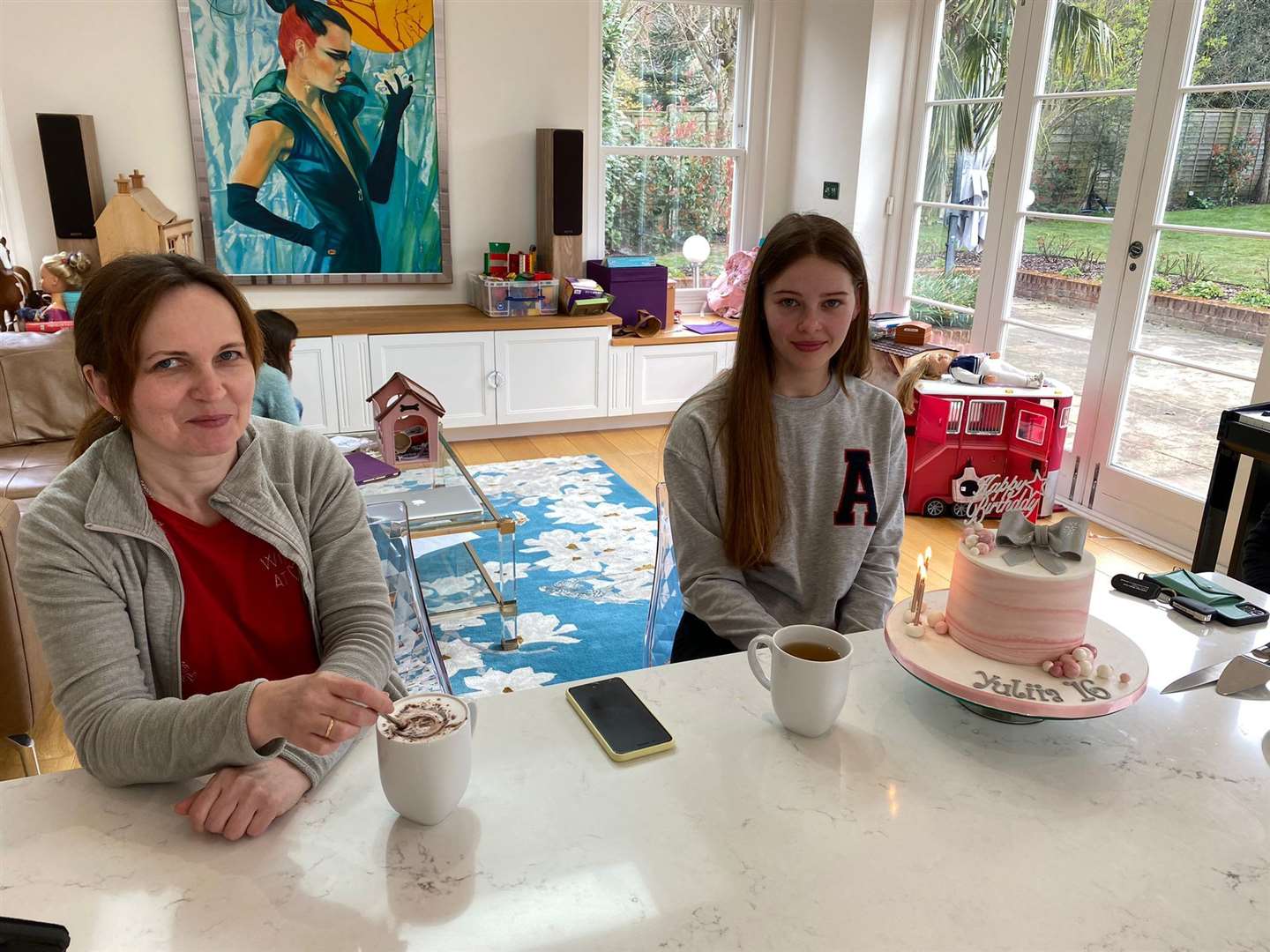 Oksana and Yulia, 16, with a birthday cake to celebrate Yulia's birthday last week