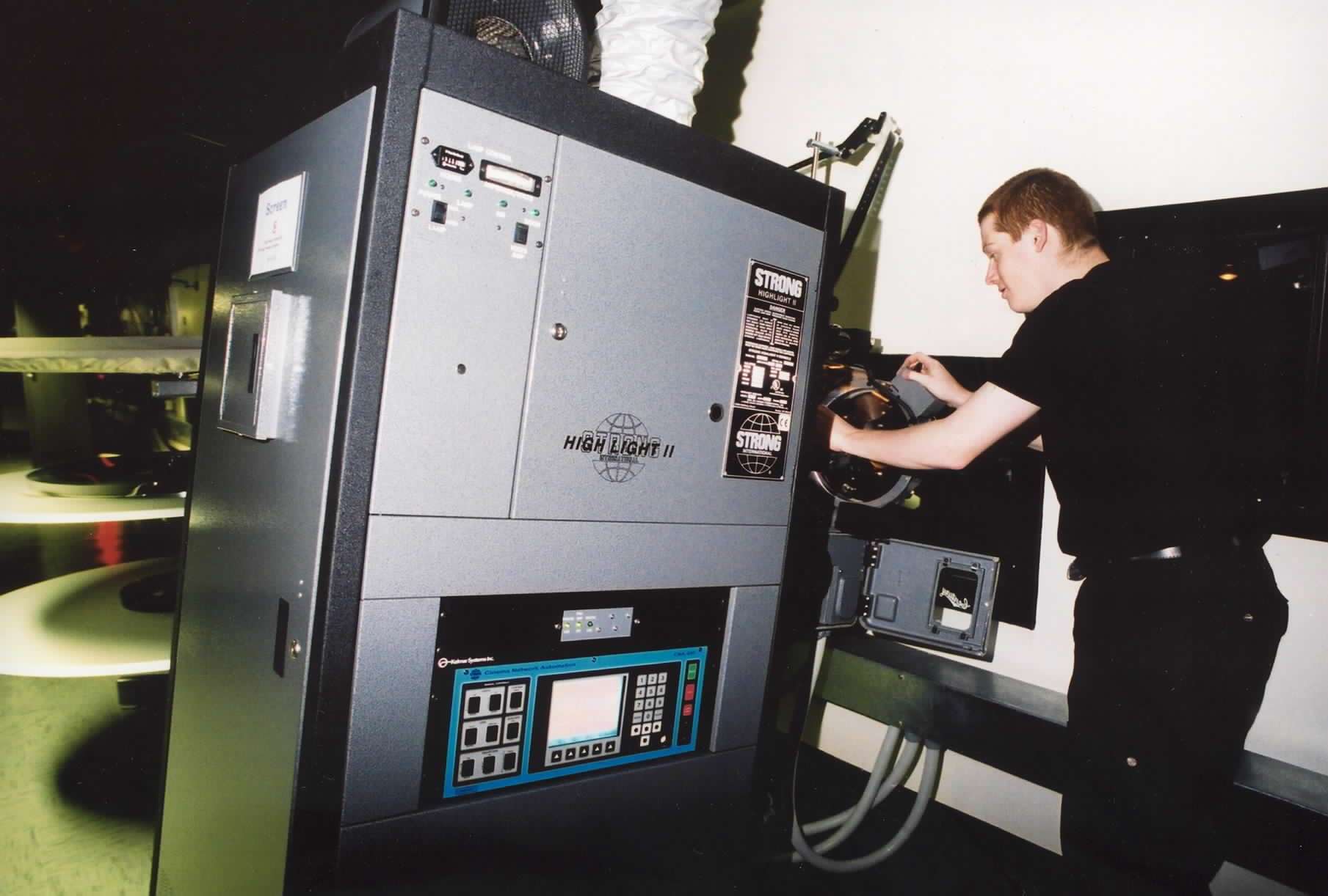 It's showtime! A projectionist at work in the early days of Ashford's Cineworld
