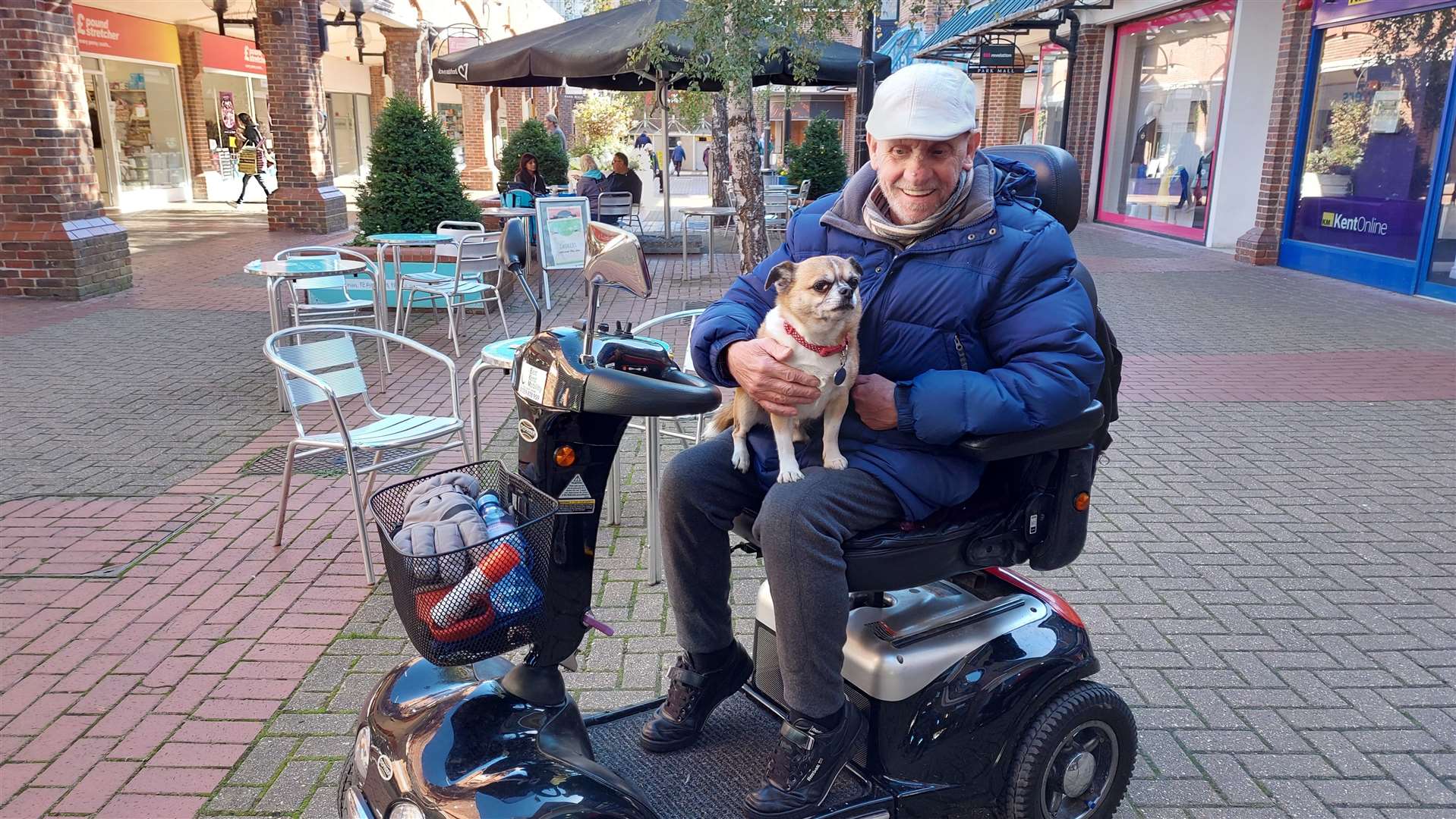 Paul Alan Coley uses his scooter to walk pooch Peanut