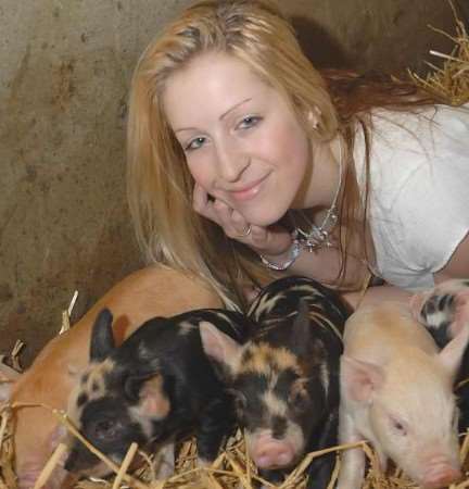 PROUD: pig breeder Andrea Walsh with some of the animals. Picture: BARRY DUFFIELD