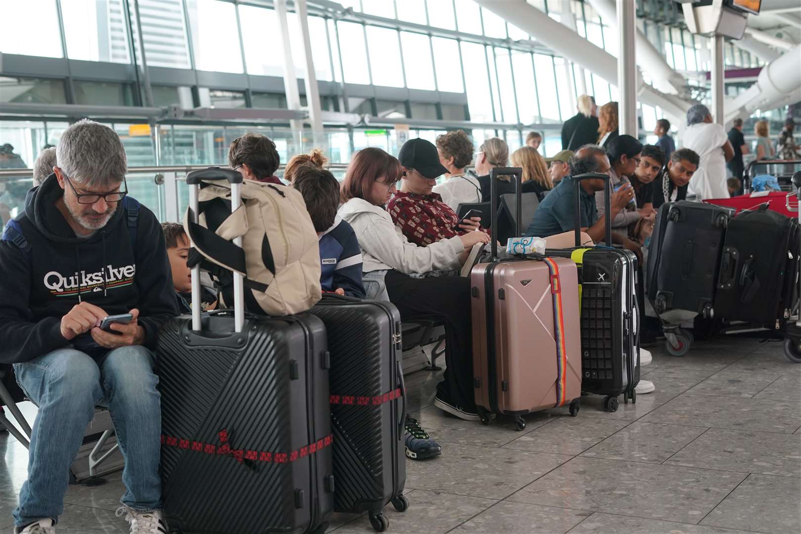 Passengers at Heathrow Airport as disruption from air traffic control issues continues across the UK and Ireland (Lucy North/PA)