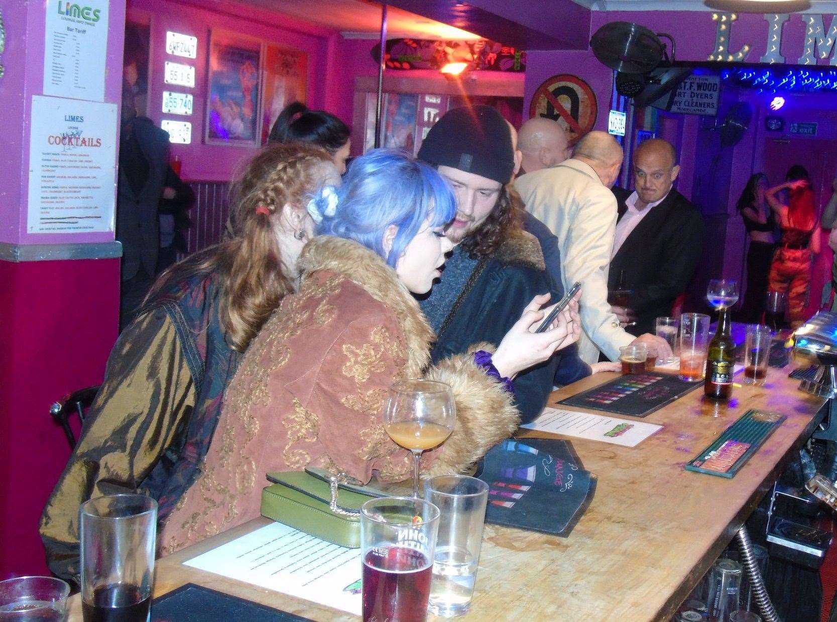 Visitors enjoying a drink at The Limes bar