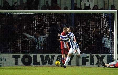 Jamie Cureton celebrates after putting Colchester 3-0 up. Picture: MATTHEW READING