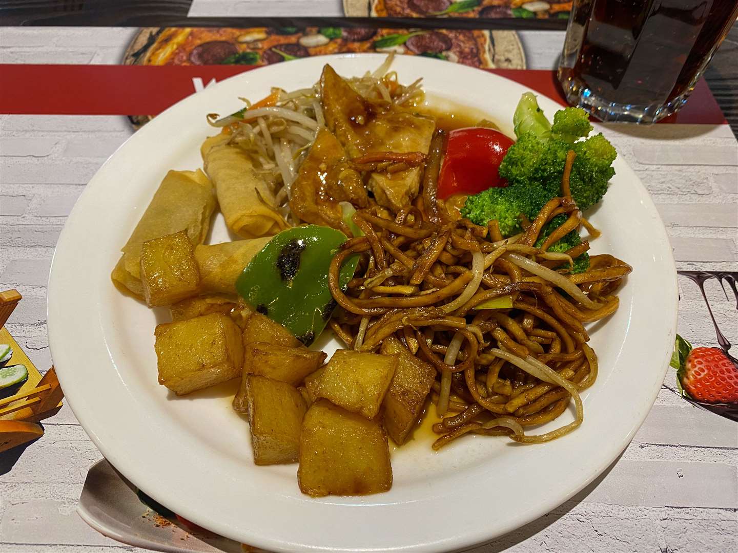 Our first plates included noodles, vegetables, tofu and crispy potatoes, which were hit and miss - lovely noodles and potatoes, but not-so-nice tofu and vegetables . Picture: Sam Lawrie