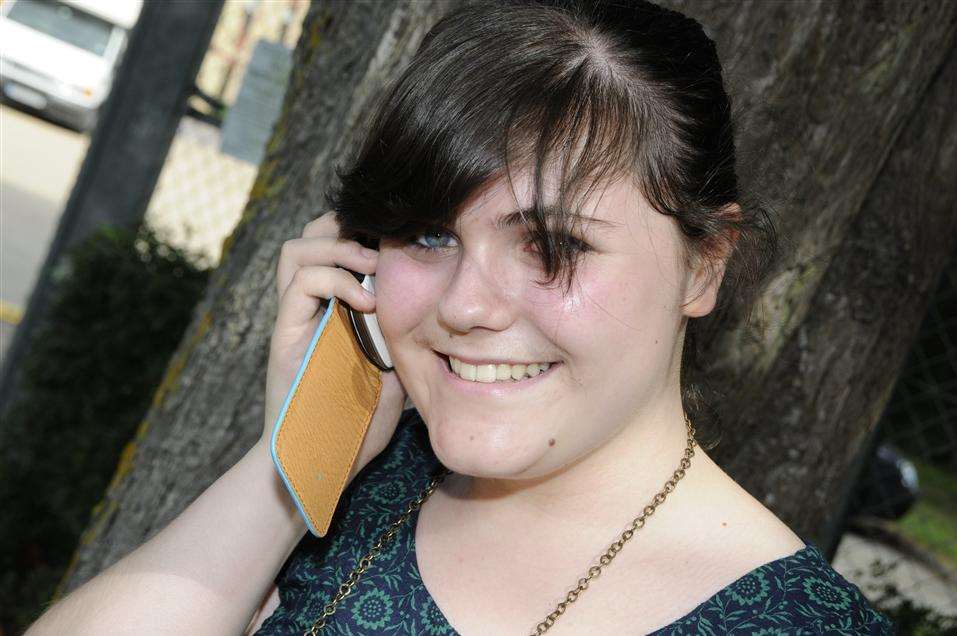 Michaela Woolley rings home with her grades last year at the John Wallis School in Ashford