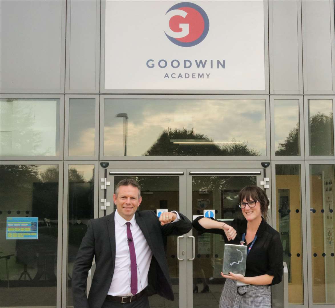 Goodwin Academy teacher Kirsty Gaythwaite bumps elbows with principal Simon Smith in celebration of receiving a silver award in the Outstanding New Teacher of the Year category of the Pearson National Teaching Awards