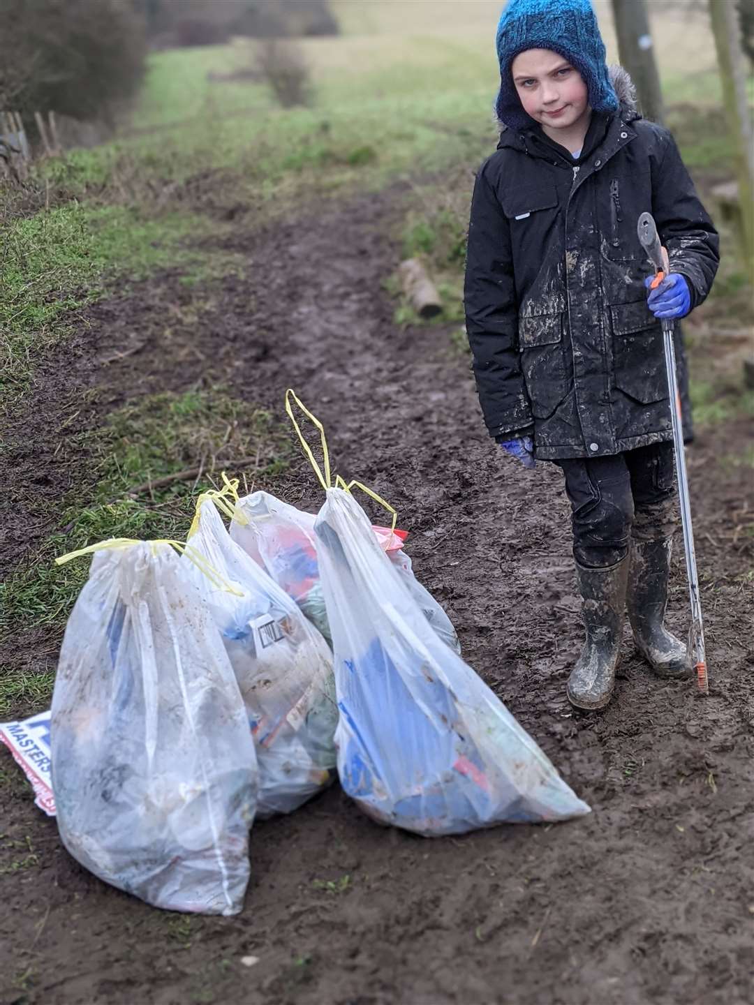 Charlie Hammell with bags of rubbish