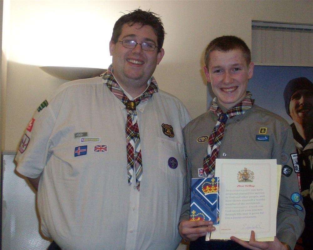Oliver Willbye holding his certificate with explorer leader Tommy Manktelow.