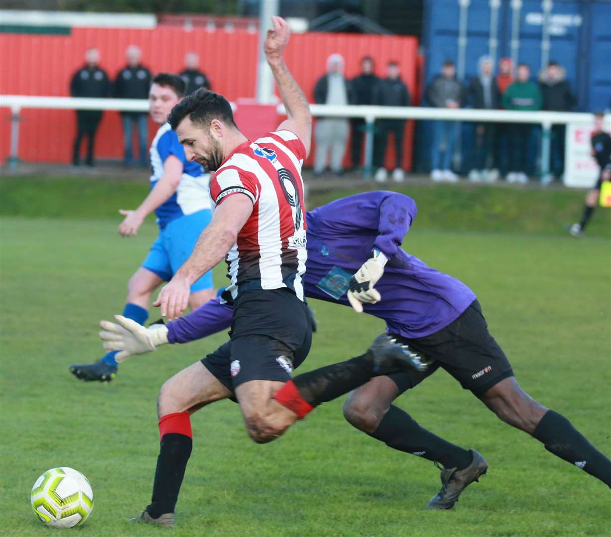 Rob Denness takes on Erith and Belvedere goalkeeper Tiawo Alui during Saturday's 5-0 win Picture: John Westhrop