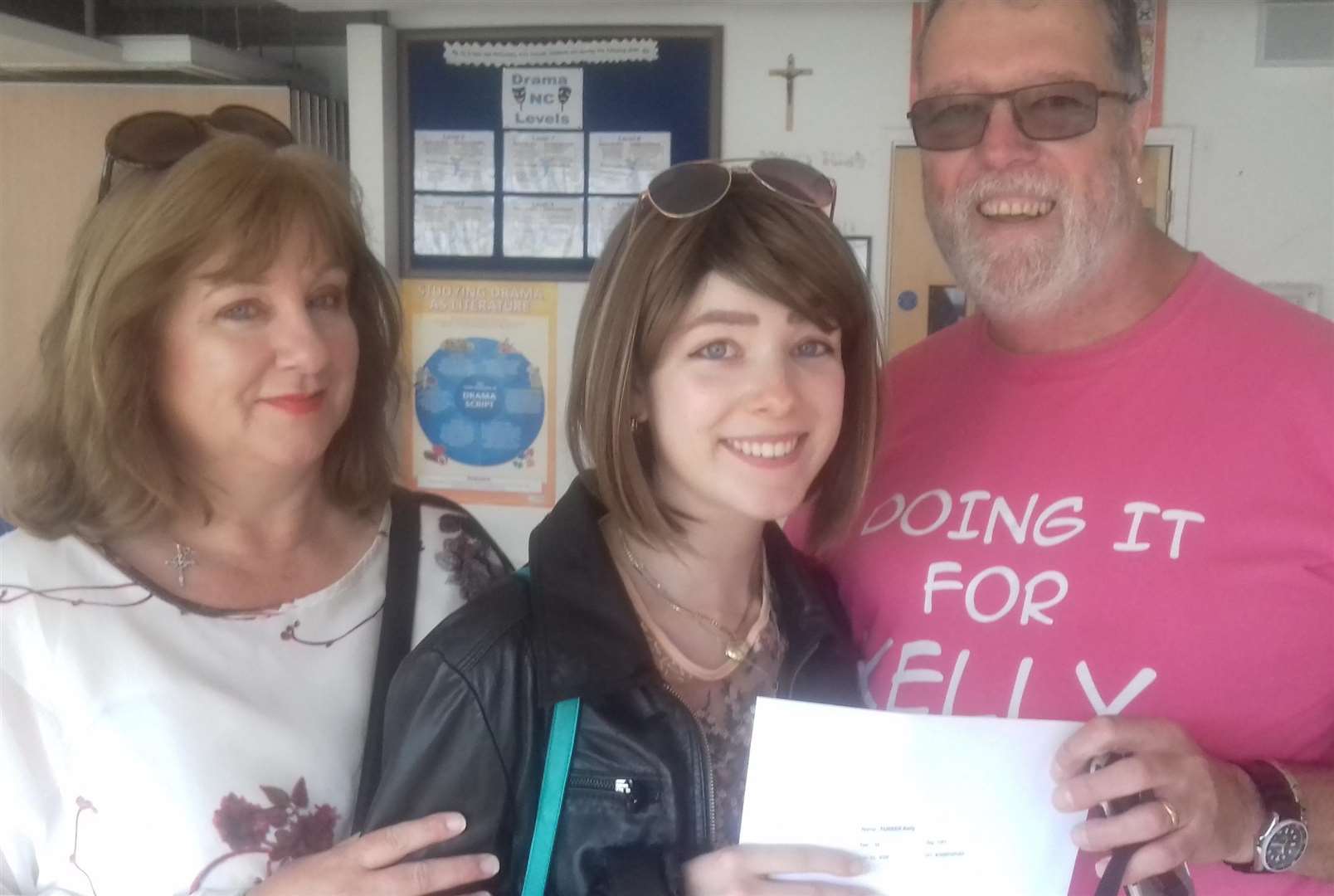 Kelly Turner receiving her GSCE results with her parents in the summer of 2017