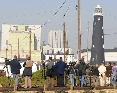 Twitchers and photographers line up see the rare visitor near Dungeness power station