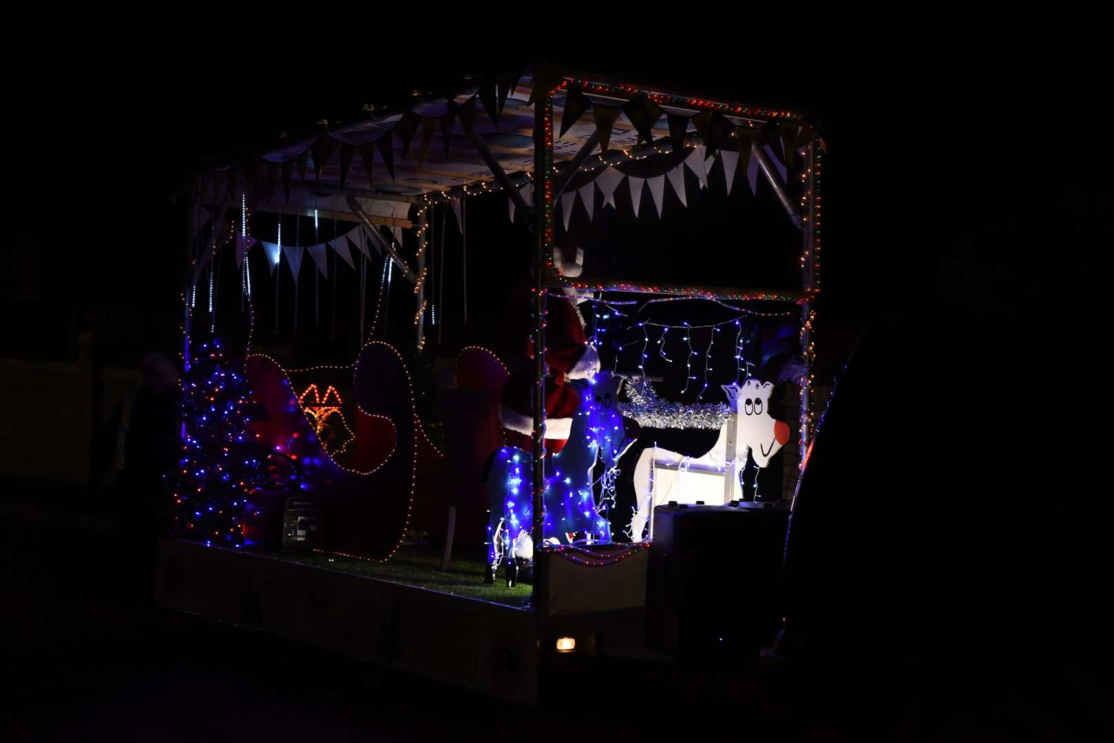 Santa's sleigh is lit up to bring festive cheer to any who see it. Picture: Ellie Crook