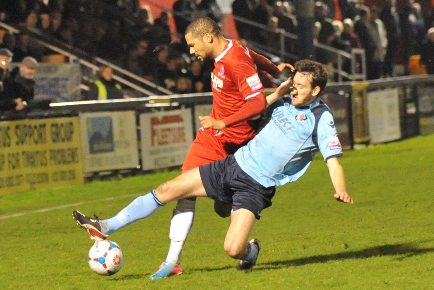 Rory McAuley challenges Welling's Ross Lafayette (Pic: Dave Budden)