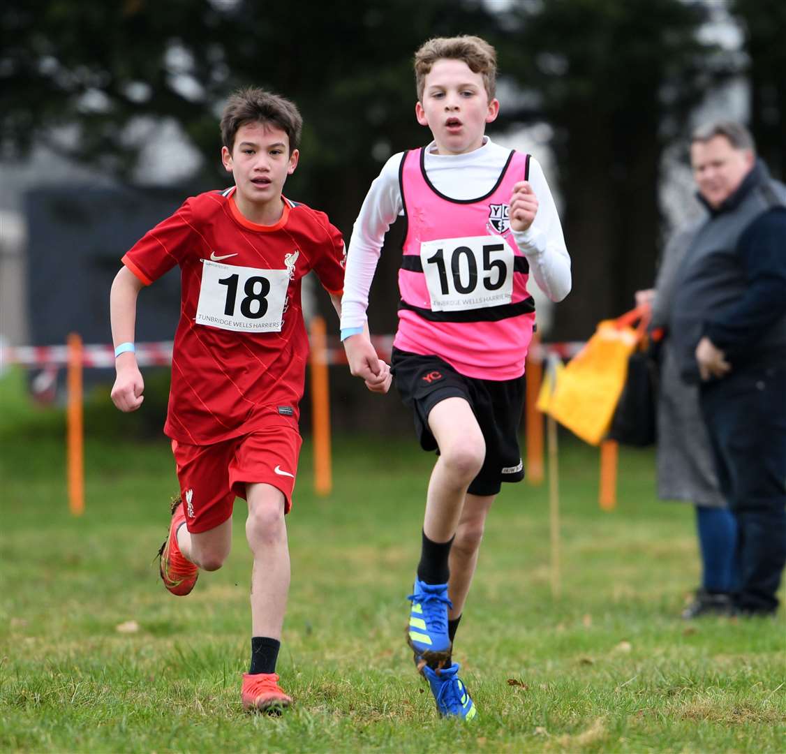 Morgan Huw (No.105) of Tonbridge leads Freddie Dixon (No.18) of Bexley in the battle for 11th place in the Year 7 boys' event. Picture: Barry Goodwin (54437731)