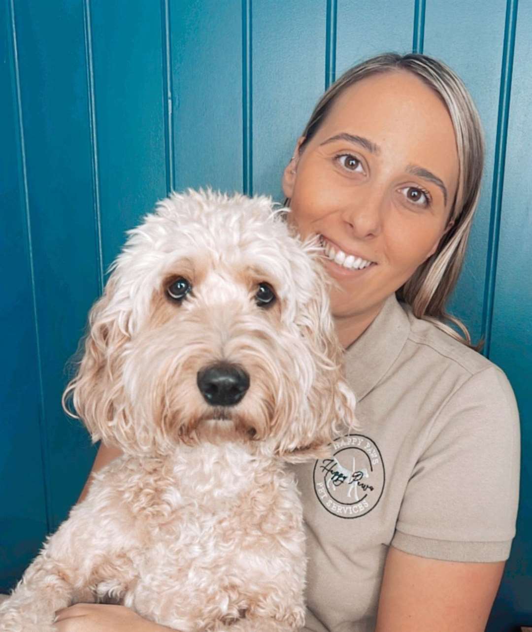Happy Paws Pet Services owner Tuesday Charlton and her own cockapoo, Daisy