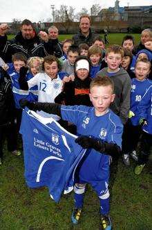 Lewis, front centre, with his team mates and managers.