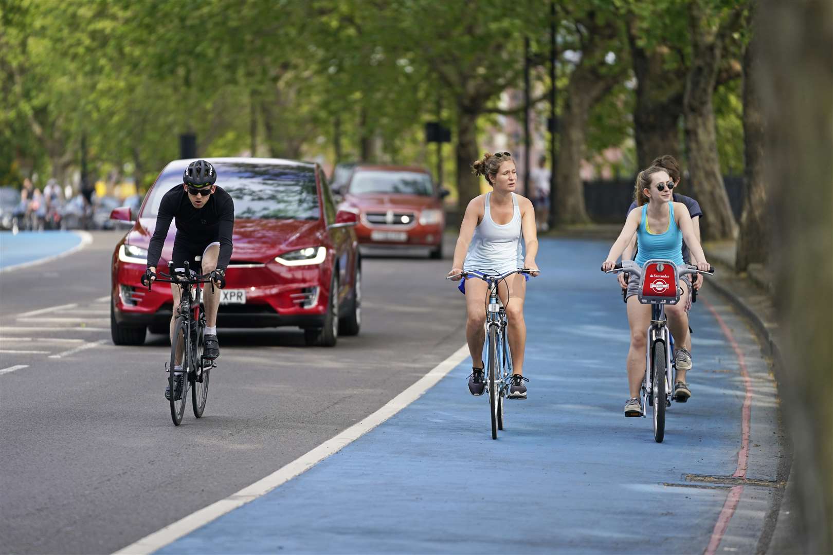 People ride bicycles in a cycle lane in Chelsea (Aaron Chown/PA)