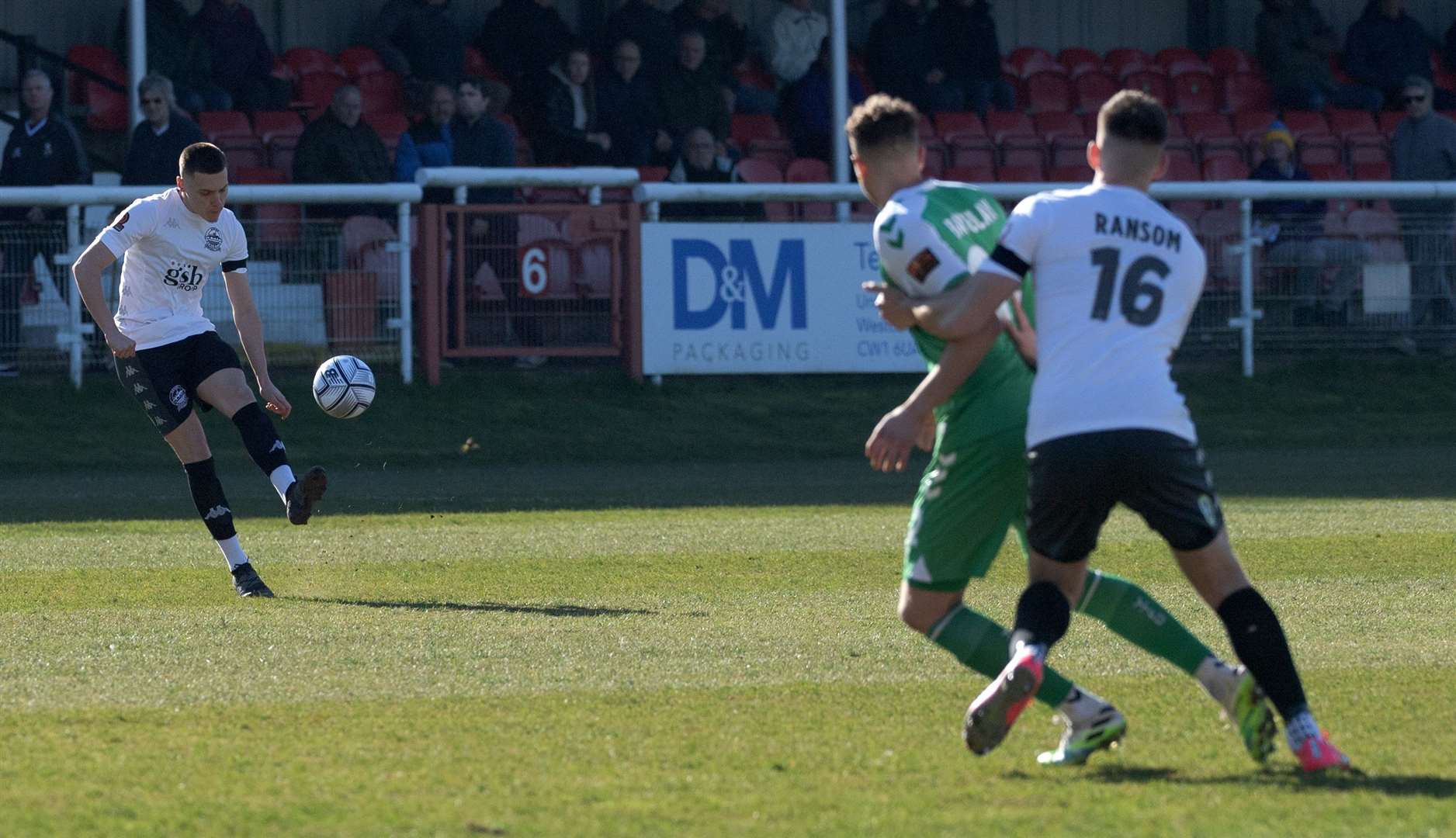 Dover's Arjanit Krasniqi clips the ball in during his side's defeat to Yeovil as Harry Ransom watches on. Picture: Stuart Brock