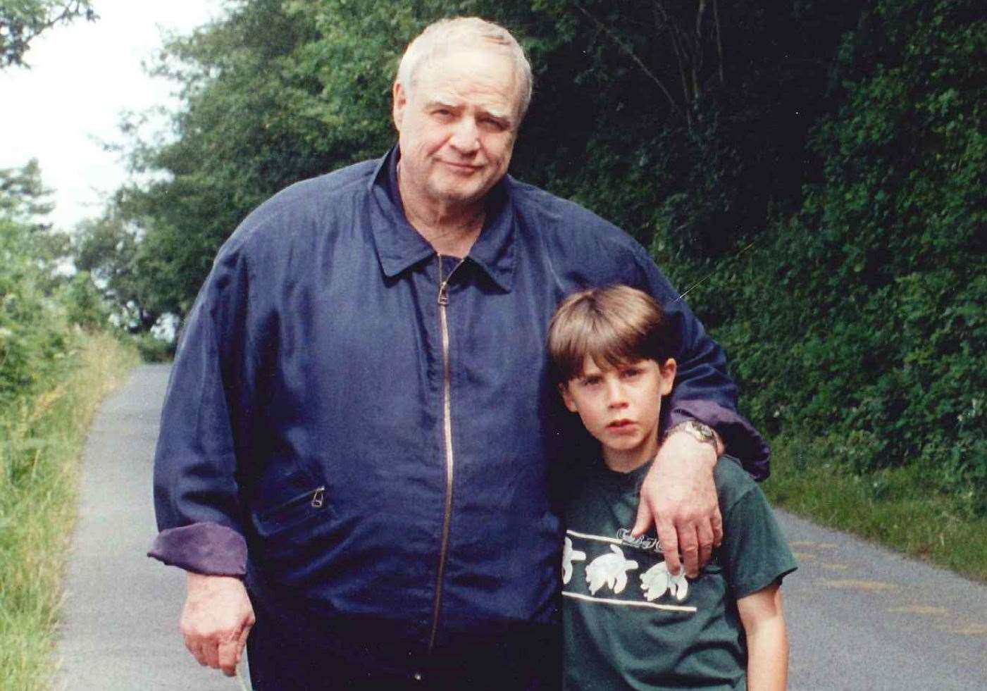 Marlon Brando with godson Christian – then aged eight – in a country lane in Selling, near Faversham. Picture: Belinda Frixou