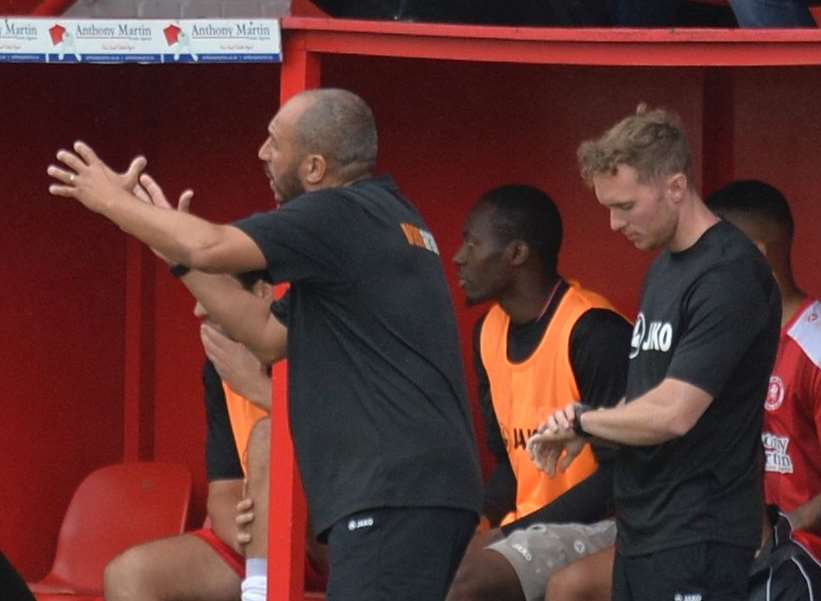 Damian Matthew, left, hands out instructions at Welling. Picture; Dave Budden