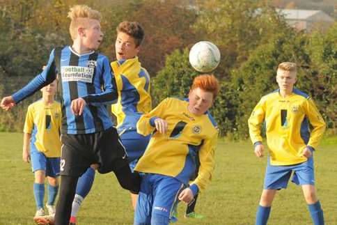 Strood 87, yellow, tackle Milton & Fulston United in Under-14 Division 1. Picture: Steve Crispe