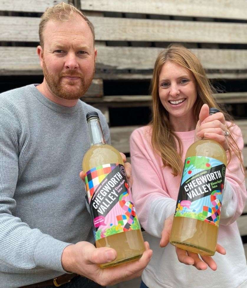 Ben Deme and Charlotte Walter with the Elmer apple juice produced at Chegworth Valley