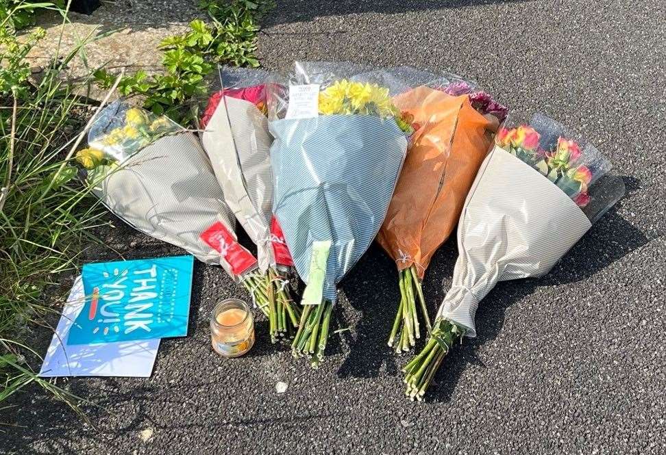 Flowers left at the scene in Harpe Inge (Katie Dickinson/PA)