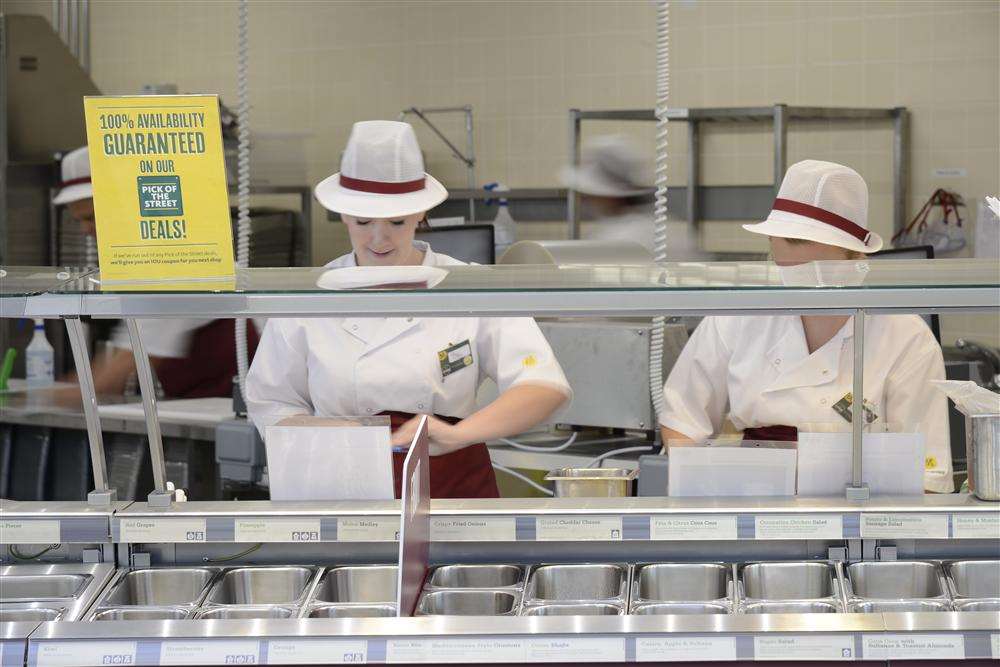 Workers preparing for the opening of the new Morrisons on Monday