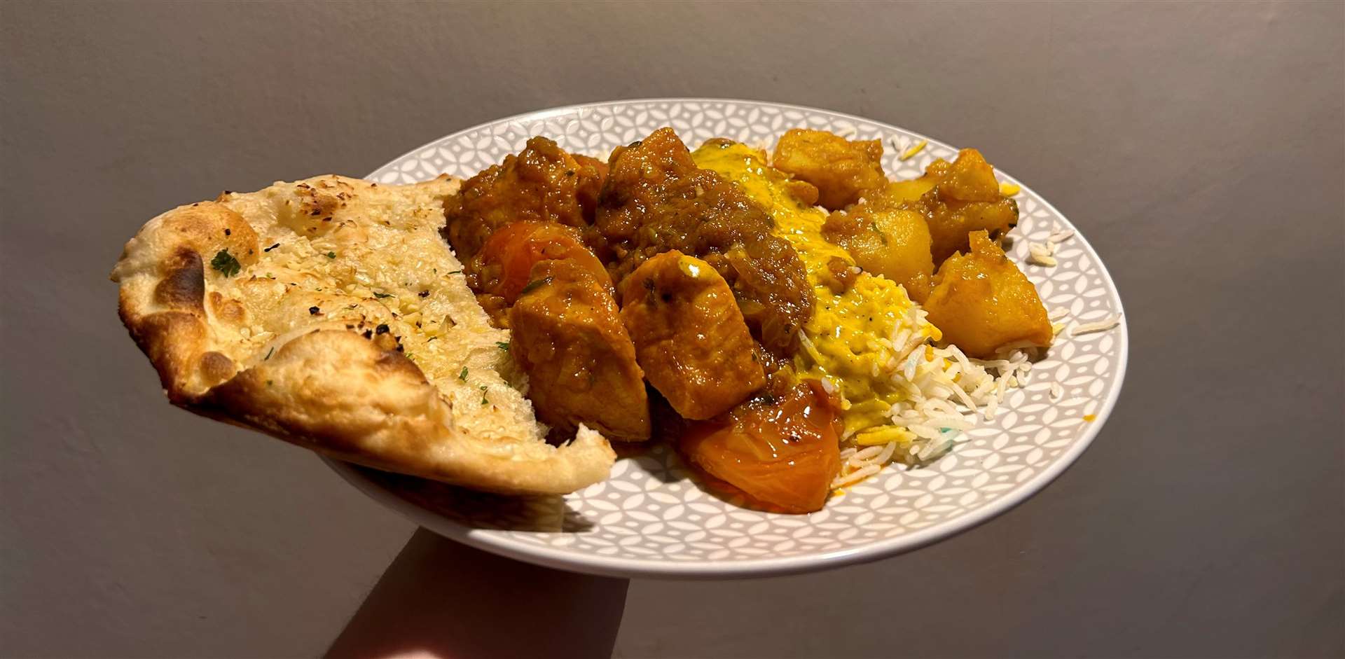 Garlic naan, chicken patia, egg fried rice, Bombay potatoes from Masala Bay
