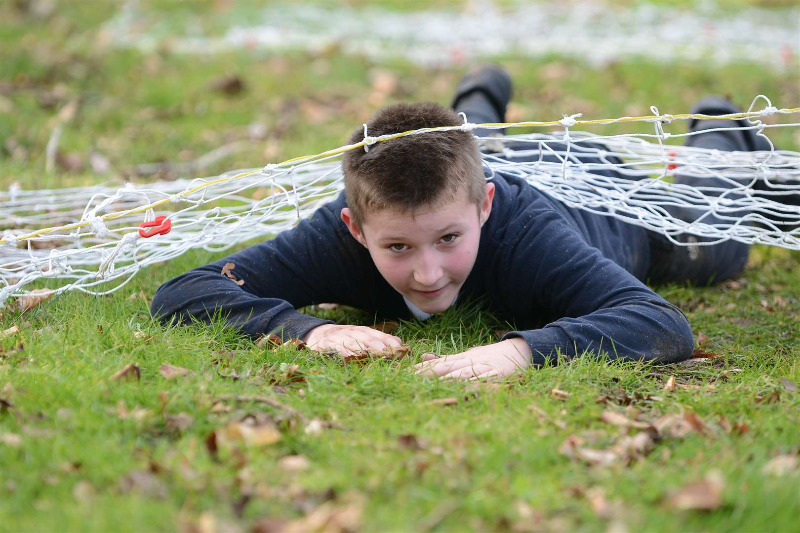 Ethan Pupils taking part in the mud mile obstacle course.
