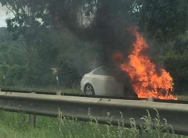 The car burst into flames. Picture: Devon White.