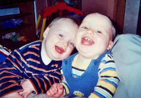 Jamie Sloan, right, known as Little Smiler, with twin brother Dominic