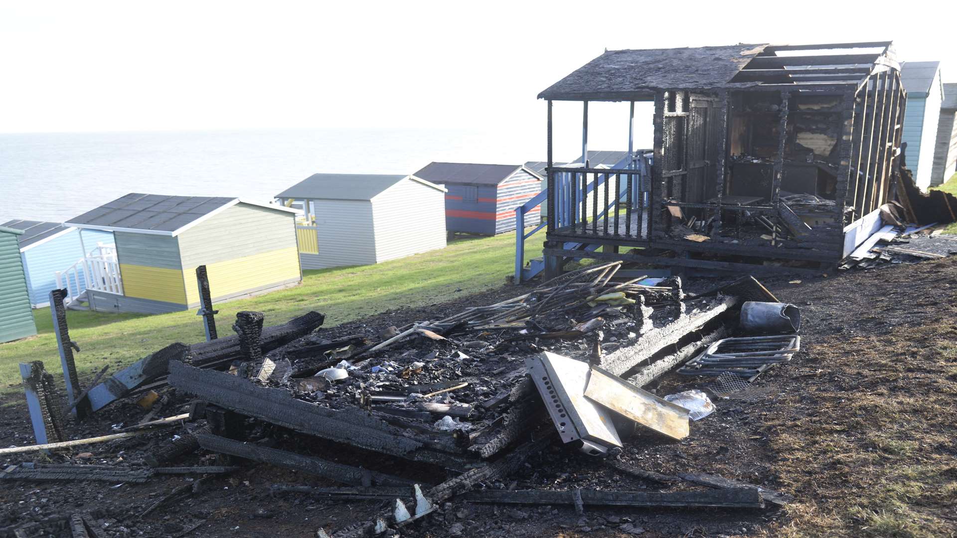 One of the burnt out beach huts on Tankerton slopes