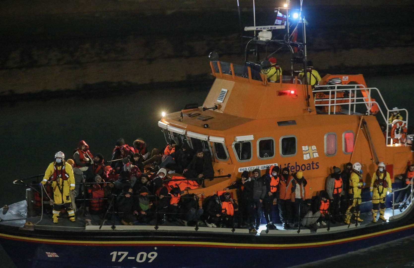 Migrants brought ashore by an RNLI rescue crew. Picture: UKNIP