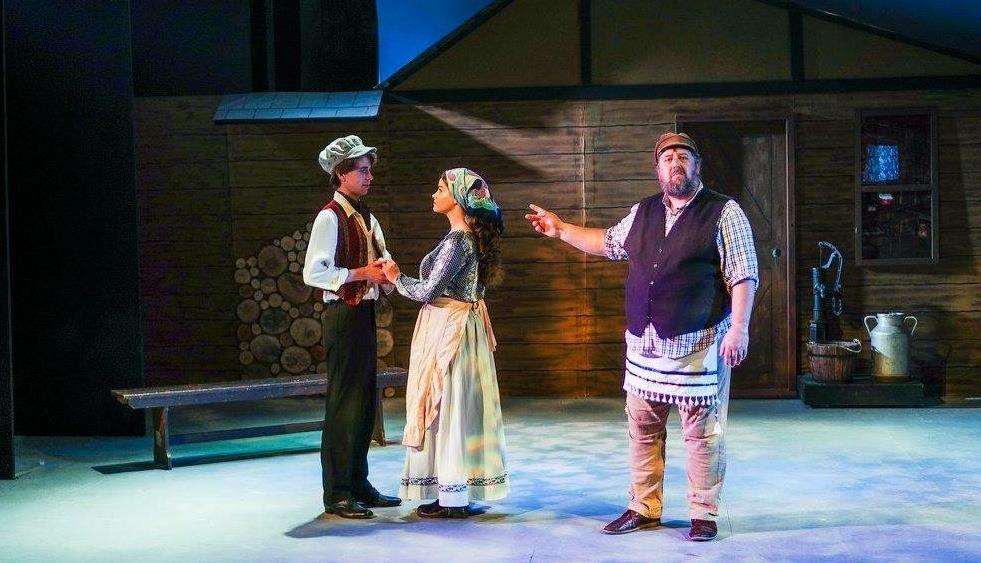 The student Perchik (Simon Gillan) and Tevye's second daughter Hodel (Isabella Jones) together with Tevye (Stephen Hawkins). The fiddler was played by Karen Prineas and the ghost of Fruma Sarah by Jeanette Lewis.