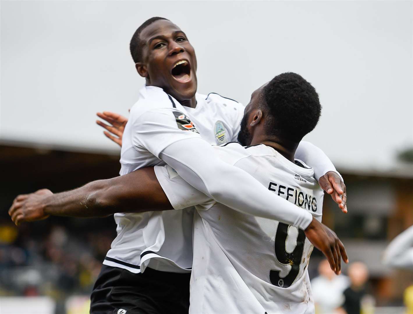 Dover strikers Ade Yusuff, left, and Inih Effiong celebrate Dover’s fourth goal during their 5-1 win against AFC Fylde on Saturday. Picture: Alan Langley