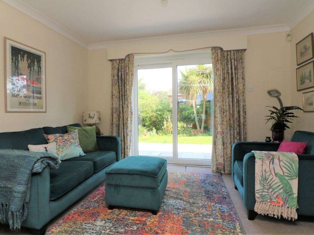 A cosy sitting room leads into an expansive back garden . Photo: Zoopla