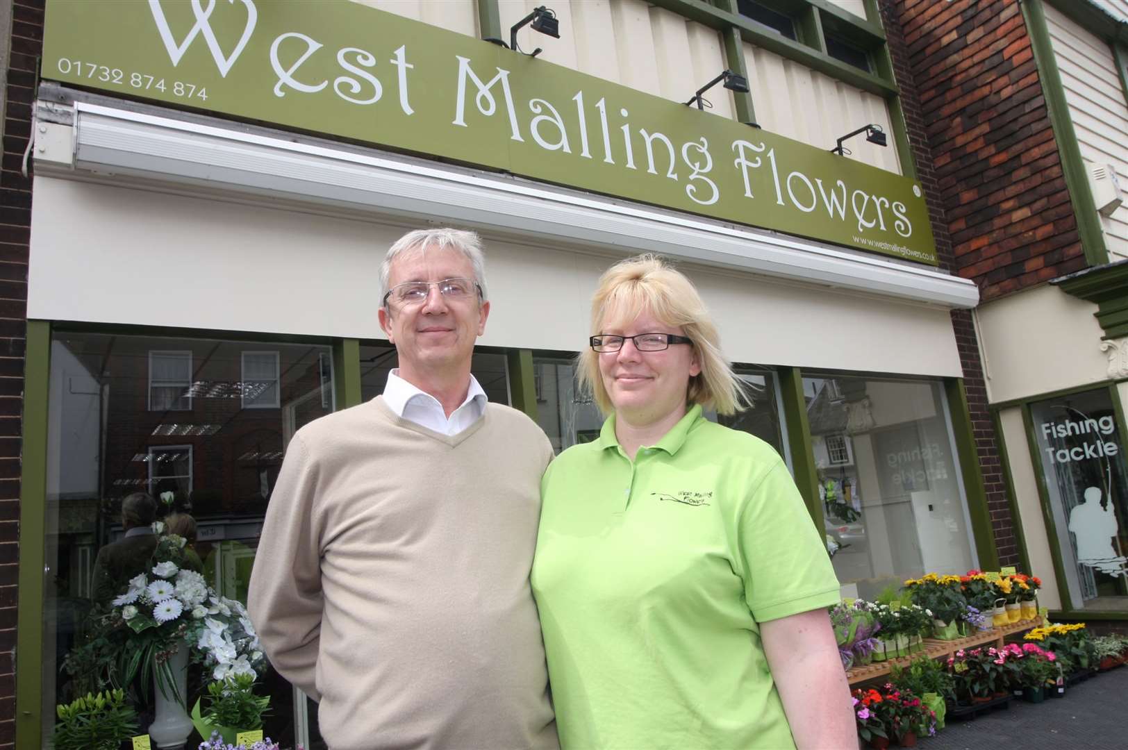 Russell Meader and his wife, Nikki outside their business